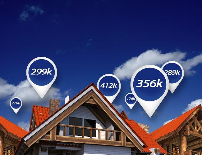 A house with a red roof in the foreground is surrounded by price bubbles showing property values, set against a blue spring sky with clouds—hinting at new opportunities in the real estate market.