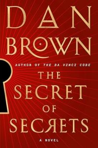 Book cover for The Secret of Secrets by Dan Brown. The red background glows with gold rays like community lights radiating from a large keyhole on the left. The title and author’s name are written in bold gold letters.