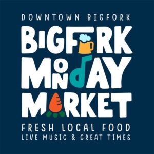 Colorful graphic text reads Downtown Bigfork Bigfork Monday Market. Fresh local food, June joys, live music & great times—with illustrations of a beer mug, musical note, and carrot integrated into the words.