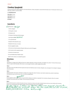 A printed Cowboy Spaghetti recipe with handwritten notes in green ink. Edits include ingredient substitutions, quantity adjustments, and tips like using Daiya cheese—perfect for July Journeys or Lake Days. The page is slightly tilted.