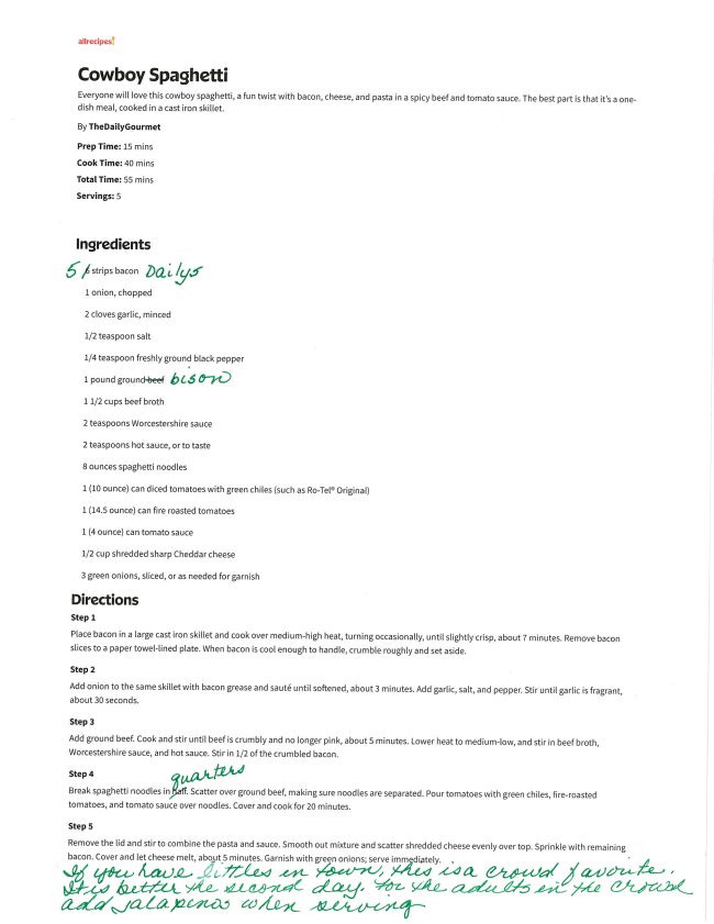 A printed Cowboy Spaghetti recipe with handwritten notes in green ink. Edits include ingredient substitutions, quantity adjustments, and tips like using Daiya cheese—perfect for July Journeys or Lake Days. The page is slightly tilted.