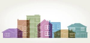 Illustration of various houses and buildings in different colors and architectural styles, overlapping on a light background, evoking the warmth and gratitude felt in diverse homes during the holiday season.