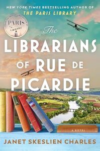 Book cover of The Librarians of Rue de Picardie by Janet Skeslien Charles, featuring stacked books in an open field during spring, with two vintage airplanes soaring above a river and quaint village.