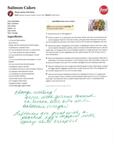 A typed recipe for salmon cakes is shown, featuring ingredients and instructions. In green cursive handwriting below, a note suggests serving with greens and white balsamic vinegar—perfect for a cozy September meal in Bigfork.