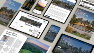 Digital devices and print magazines display real estate webpages, articles, and a Luxury Outlook cover featuring a large house, all arranged on a light surface to showcase media diversity during the Holiday Season.