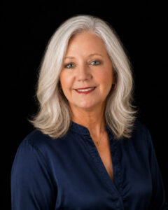 Denise Lang, Bigfork and Flathead Valley's Best Real Estate Agent. Her Alternate Headshot. Blue eyes, light hair.